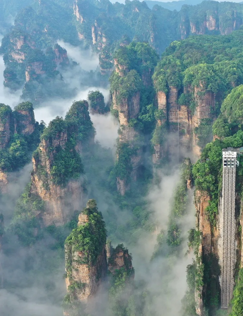 Spectacular view of sandstone pillars towering above clouds in Zhangjiajie National Forest Park